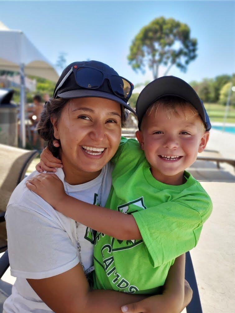Counselor holding a camper