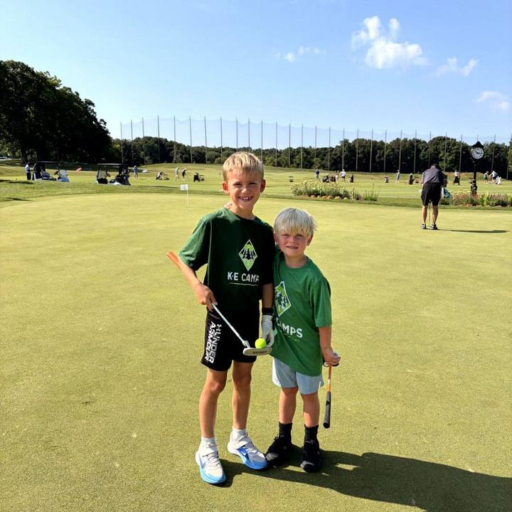 Two campers with golf clubs