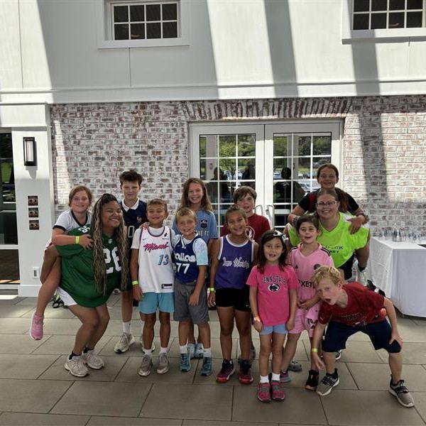 Staff and campers on the clubhouse steps